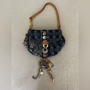 Judy Blame Denim Striped Pleaty Mini Raye Bag in Blue.